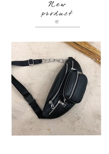 Detail of black multi-pocket waist bag with metal chain strap and matte synthetic leather