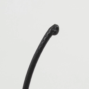 Close-up of black braided cord necklace with glossy texture and ball end detail