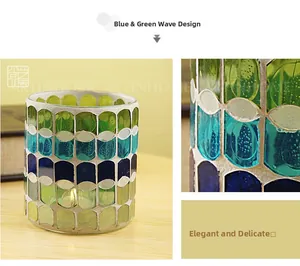 Detail of blue and green mosaic glass candle holder with handcrafted wave patterns