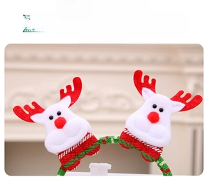 Detailed close-up of Christmas reindeer headband with soft plush fabric and festive antlers