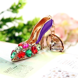 Detail of purple enamel high heel keychain with colorful rhinestones and gold plating