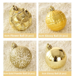 Detail of four 6cm gold Christmas ornaments with glitter snowflake and textured patterns