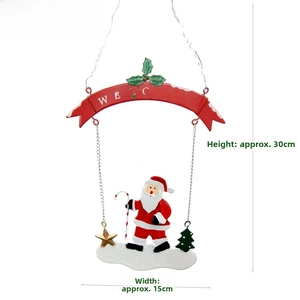 Detail of Santa Claus metal hanging decor with red Welcome banner and gold star hook