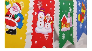 Close-up of colorful Christmas banner bunting with Santa Claus and Snowman cartoon patterns