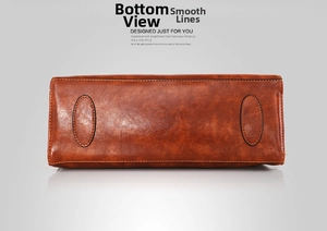 Detailed bottom view of brown oil wax leather handbag with oval reinforced stitching