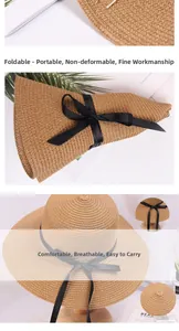 Detail of foldable straw sun hat with black ribbon showing portability and woven texture