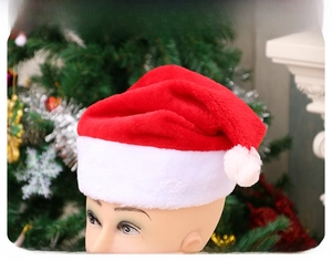 Detailed plush texture of the red Christmas hat featuring wide white faux fur brim