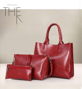 Three-piece red oil wax leather set featuring tote, shoulder bag, and zipper pouch