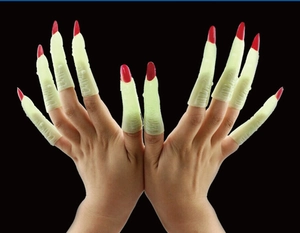 Close-up of ten glowing zombie witch fingernail props for Halloween costume parties