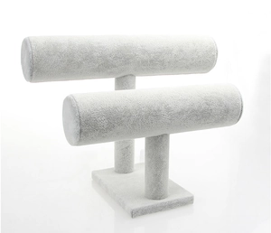 Detail view of double-layer light grey velvet jewelry display stand for watches and bracelets
