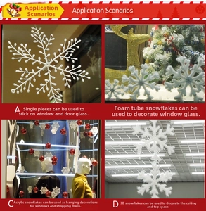 Close-up of assorted white Christmas snowflake decorations including foam and acrylic styles