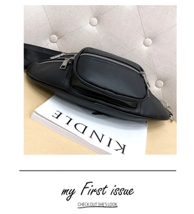 Detail view of black PU leather waist bag featuring pebbled texture and silver zippers