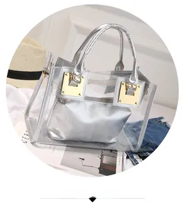 Detailed view of clear PVC jelly tote bag with silver inner pouch and gold buckles