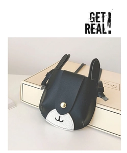 Detail of cartoon animal mini crossbody bag with black ears and litchi grain leather