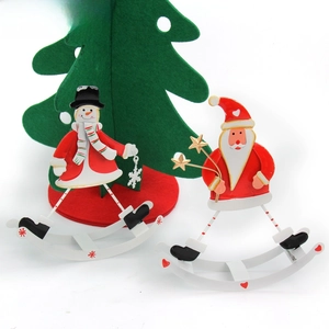Rocking metal Christmas tabletop ornaments featuring Santa Claus and a snowman figures