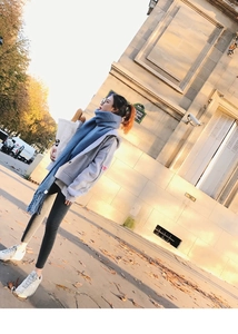 Detailed texture of light blue mohair scarf styled with a casual winter street outfit
