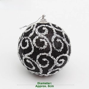 Close-up of 8cm black Christmas ball with silver glitter spiral patterns and hanging loop