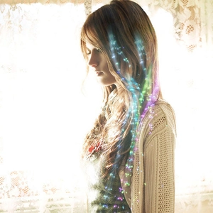 Detail showing glowing LED colorful fiber optic braids entwined in hair for parties