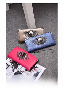 Three leather skull wallets in gold, navy and rose with vintage metallic ornaments