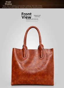 Front view of vintage brown oil wax leather tote bag with refined stitching and top handles