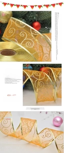 Macro detail of gold sheer Christmas ribbon with sparkling glitter spiral patterns