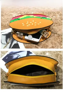 Detail of hamburger shaped crossbody bag showing interior capacity and golden chain strap