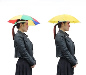 Detail view of multi-color and yellow headwear umbrellas with elastic headbands