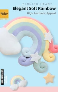 Detailed view of a soft rainbow plush pillow with cute star accents and white cloud ends