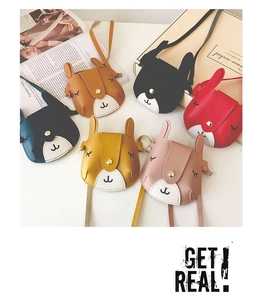 Flat lay of colorful bunny-shaped PU leather crossbody bags for kids in six vibrant colors