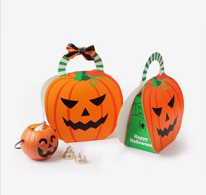 Detailed view of Halloween pumpkin gift boxes and mini pails with Happy Halloween text