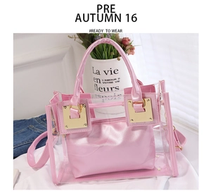 Pink transparent PVC jelly beach bag detail with matching interior pouch and gold buckles