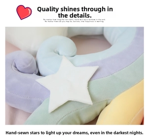 Close-up of handmade star detail on soft macaron rainbow plush cushion with fine stitching