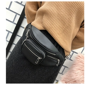 Close-up of black PU leather waist bag details with smooth texture and sturdy zippers