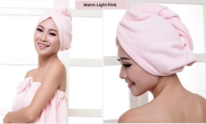 Detail of soft pink microfiber hair drying cap and matching bath towel set with bow decoration