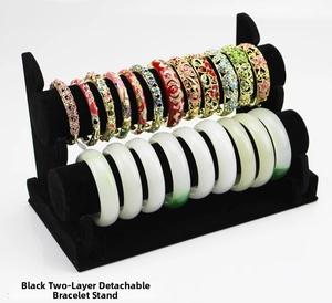 Detail view of double-layer black velvet jewelry stand for bracelets and watches
