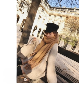 Outdoor street style look featuring a camel fringe knitted scarf and black newsboy cap