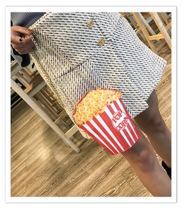 Close-up of popcorn-shaped chain crossbody bag with red and white stripes for women