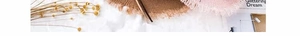 Close-up of woven straw hats with fringed edges in light brown and pink vacation style