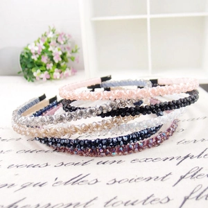 Close-up of multi-color beaded headbands featuring a woven crystal design and slim fit