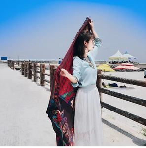 Close-up of bohemian paisley shawl fabric with vibrant ethnic patterns for beach travel