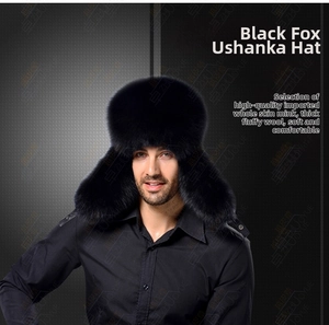 Close-up of premium thick black fox fur ushanka hat showing soft dense texture