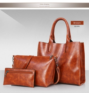 Three-piece brown PU leather handbag set showing tote, crossbody bag, and wallet