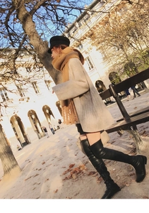 French casual street style showing warm camel mohair scarf with a chic grey sweater