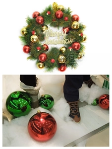 Macro shot of silver and gold Christmas ornaments on festive green pine wreaths