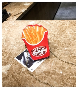 Detail view of the creative french fries shaped crossbody bag with gold chain strap