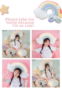 Macro view of macaron-colored plush pillows showing soft velvet fabric and pastel star shapes