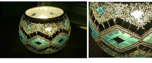 Detail shot of handcrafted black and green mosaic glass tea light candle holder