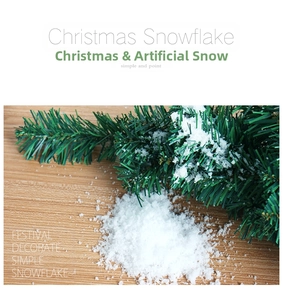 Macro shot of fluffy artificial snow powder scattered on pine needles for Christmas decor