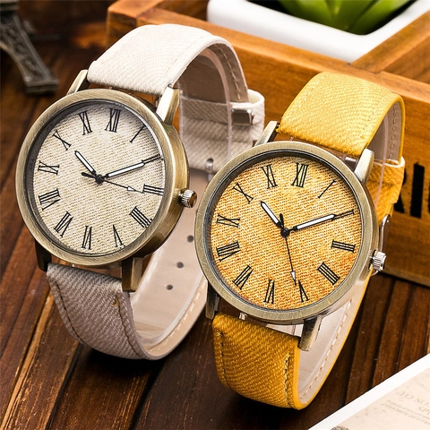 Orologio al Quarzo in Lega Vintage per Donna Numeri Romani Trama Denim Cinturino in Similpelle Cassa in Bronzo Moda Casual