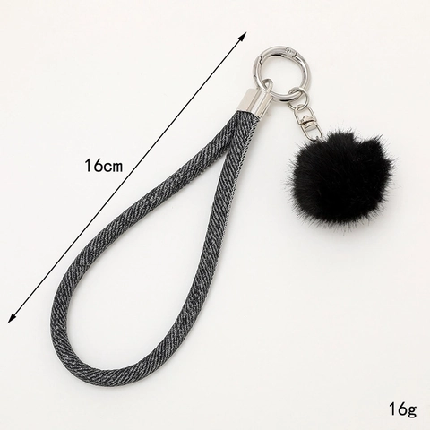 Porte-clés en Cuir Denim à la Mode Pendentif de Sac avec Boule en Peluche Douce et Dragonne Tissée pour Femmes Bijou avec Fermoir en Métal